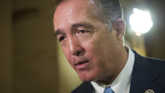 FILE - In this March 24, 2017, file photo, Rep. Trent Franks, R-Ariz. speaks with a reporter on Capitol Hill in Washington. Franks is calling on special counsel Robert Mueller to resign, citing what h ...