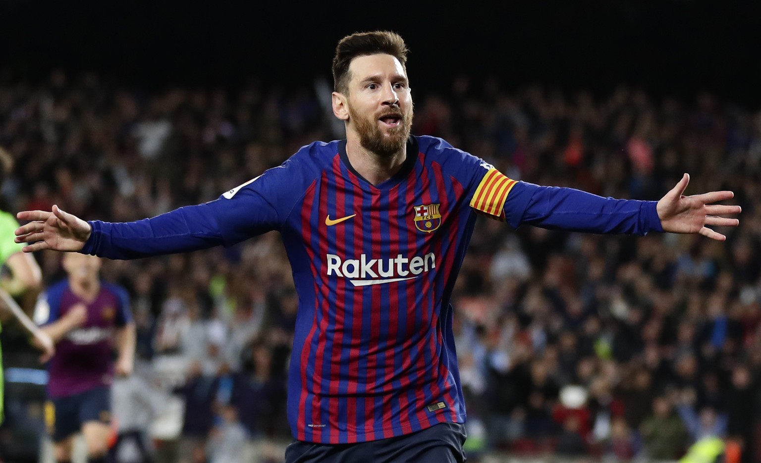 Barcelona forward Lionel Messi celebrates after scoring his side&#039;s opening goal during a Spanish La Liga soccer match between FC Barcelona and Levante at the Camp Nou stadium in Barcelona, Spain, ...