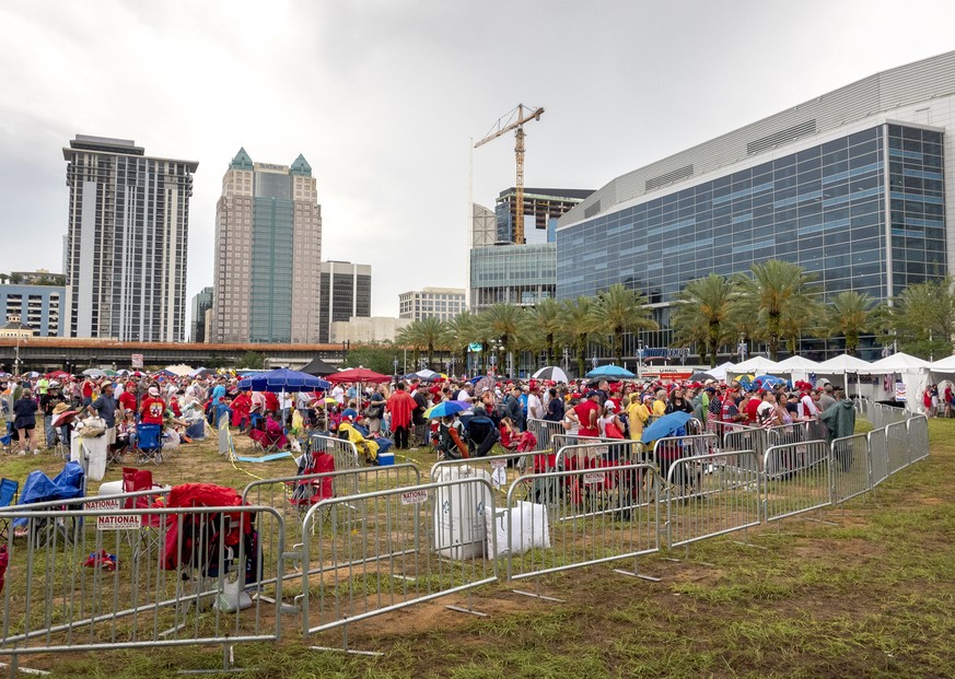 epa07656654 US President Donald J. Trump&#039;s supporters make a line to enter the Amway center to attend Trump&#039;s 2020 re-election bid announcement in Orlando, Florida, USA, 18 June 2019. Presid ...