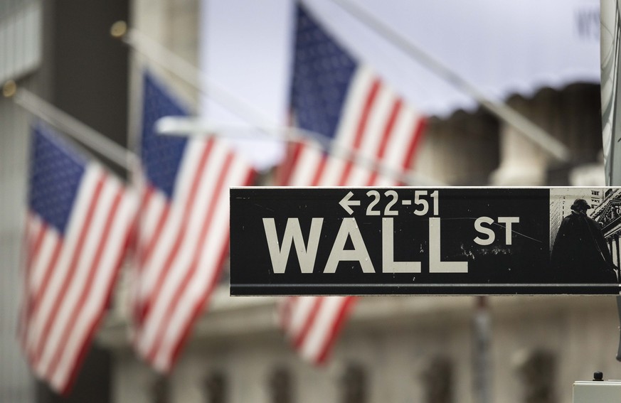 epa08781436 A sign for Wall Street outside of the New York Stock Exchange in New York, New York, USA, 28 October 2020. Stocks were down again today, with the Dow Jones industrial average down over 800 ...