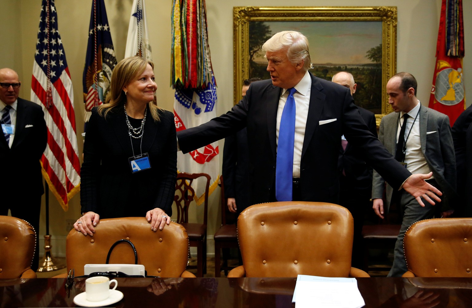 U.S. President Donald Trump talks with General Motors CEO Mary Barra as he hosts a meeting with U.S. auto industry CEOs at the White House in Washington January 24, 2017. REUTERS/Kevin Lamarque