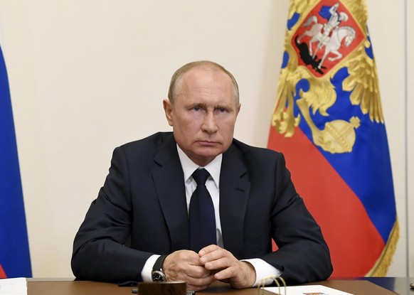 Russian President Vladimir Putin, addresses the nation via video conference at the Novo-Ogaryovo residence outside Moscow, Russia, Monday, May 11, 2020. Putin, speaking in a televised address to the n ...