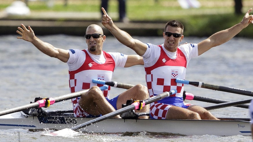 Croatia&#039;s Martin Sinkovic and Valent Sinkovic celebrate after winning the Final Men&#039;s Double Sculls event of the World Rowing Championships in Amsterdam, Netherlands, Sunday, Aug. 31, 2014.  ...