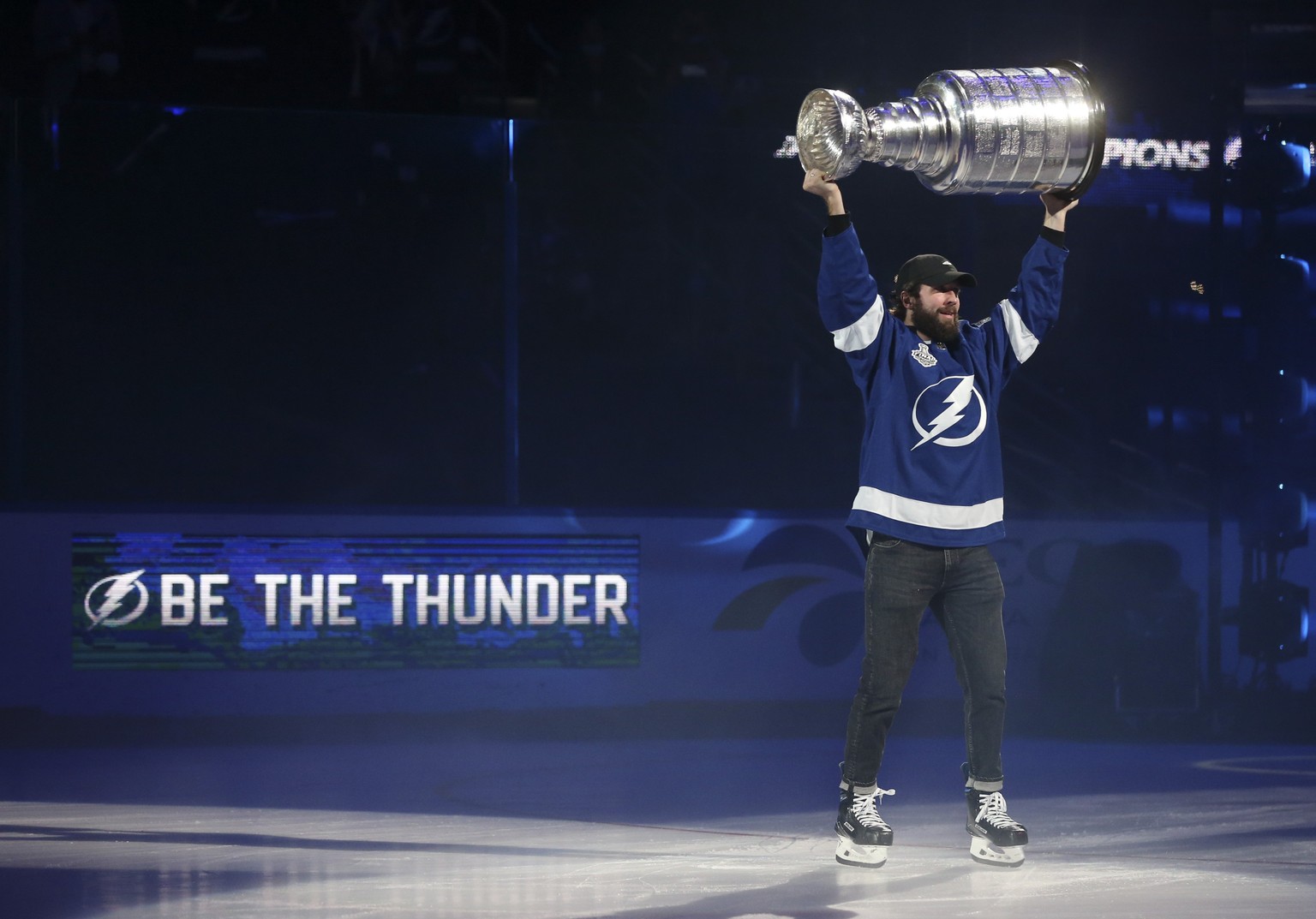 Tampa Bay Lighting&#039;s Nikita Kucherov holds the Stanley Cup in the air while skating around Amalie Arena, Tuesday, Sept. 29, 2020, in Tampa, Fla. (Dirk Shadd/Tampa Bay Times via AP)