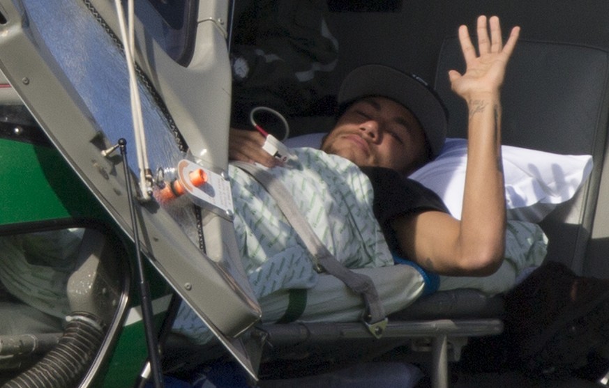 Brazil&#039;s Neymar waves as he lies inside a medical helicopter at the Granja Comary training center, in Teresopolis, Brazil, Saturday, July 5, 2014. Neymar was airlifted from Brazil&#039;s training ...