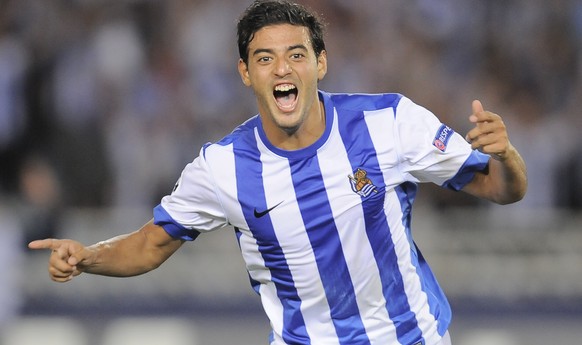FILE - In this Aug. 28, 2013 file photo, Real Sociedad&#039;s Carlos Vela of Mexico, celebrates after scoring his second goal against Olympique Lionnais during their Europa Champions League second leg ...