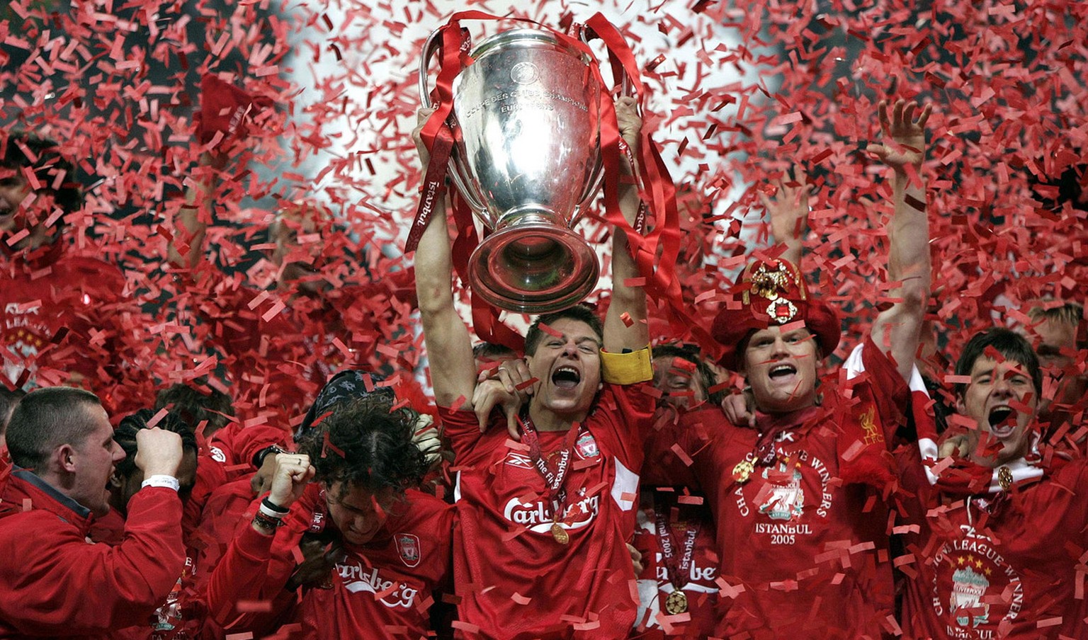 Liverpool&#039;s captain Steven Gerrard, center, lifts the Champions League trophy at The Ataturk Olympic Stadium, Istanbul, Turkey, Wednesday May 25, 2005. Liverpool won the Champions League final be ...