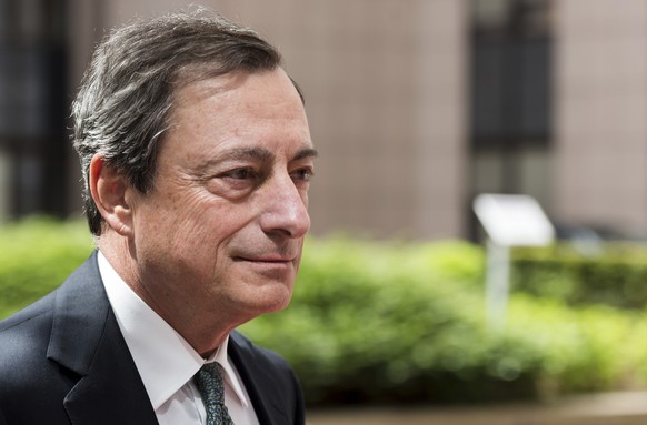 FILE - In this May 11, 2015 file photo, European Central Bank Governor Mario Draghi arrives for a meeting of the eurogroup finance ministers at the EU Council building in Brussels. Speaking Thursday a ...