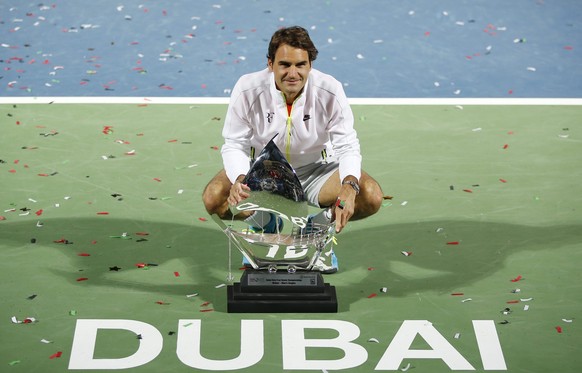 epaselect epa04641975 Roger Federer of Switzerland celebrates winning the final match against Novak Djokovic of Serbia at the Dubai Duty Free Tennis ATP Championships in Dubai, United Arab Emirates, 2 ...