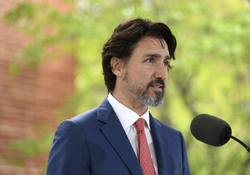 Canadian Prime Minister Justin Trudeau speaks during his daily news conference on the COVID-19 pandemic outside his residence at Rideau Cottage in Ottawa, Ontario, on Tuesday, May 19, 2020. (Justin Ta ...