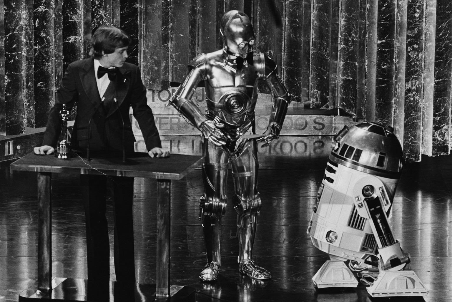 Mark Hamill
Actor Mark Hamill presenting an award with his Star Wars co-stars C3PO and R2D2, at the 50th Academy Awards, Los Angeles, April 3rd 1978. (Photo by Archive Photos/Getty Images)