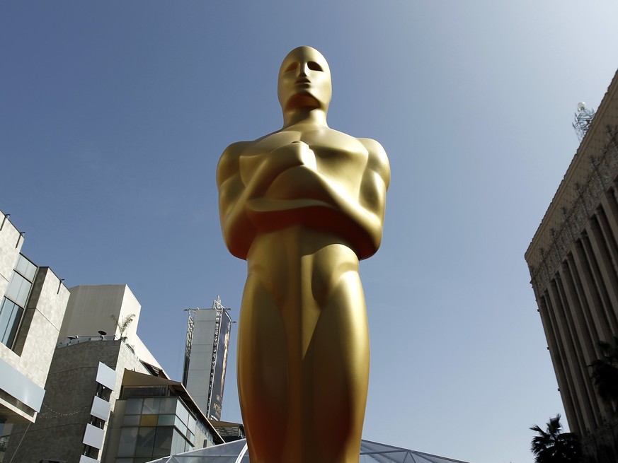 FILE - This Feb. 26, 2012 file photo, shows an Oscar statue on the red carpet before the 84th Academy Awards in Los Angeles. The 88th Academy Awards nominations will be announced on Thursday, Jan. 14, ...