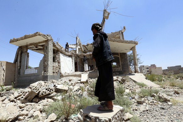 epa07854285 Men inspect debris of a destroyed house allegedly hit by a previous Saudi-led airstrike in Sana&#039;a, Yemen, 19 September 2019. Yemen has been in the grip of a devastating power struggle ...