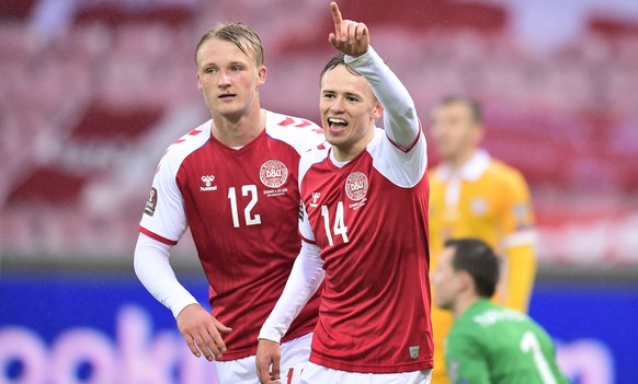 epa09103370 Denmark&#039;s Mikkel Damsgaard (R) celebrates with team-mate with team mate Kasper Dolberg after scoring a goal during the FIFA World Cup 2022 qualifiers match between Denmark and Moldova ...
