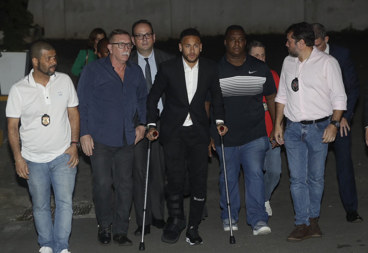 Using crutches because of an injured right ankle, Brazil&#039;s soccer player Neymar leaves a police station where he answered questions about rape allegations against him in Sao Paulo, Brazil, Thursd ...
