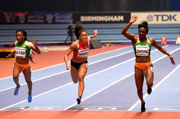 epa06575956 Murielle Ahoure from the Ivory Coast wins the Women&#039;s 60m final ahead of compatriot Marie-Josee Ta Lou and Mujinga Kambundji of Switzerland during the IAAF Athletics World Indoor Cham ...
