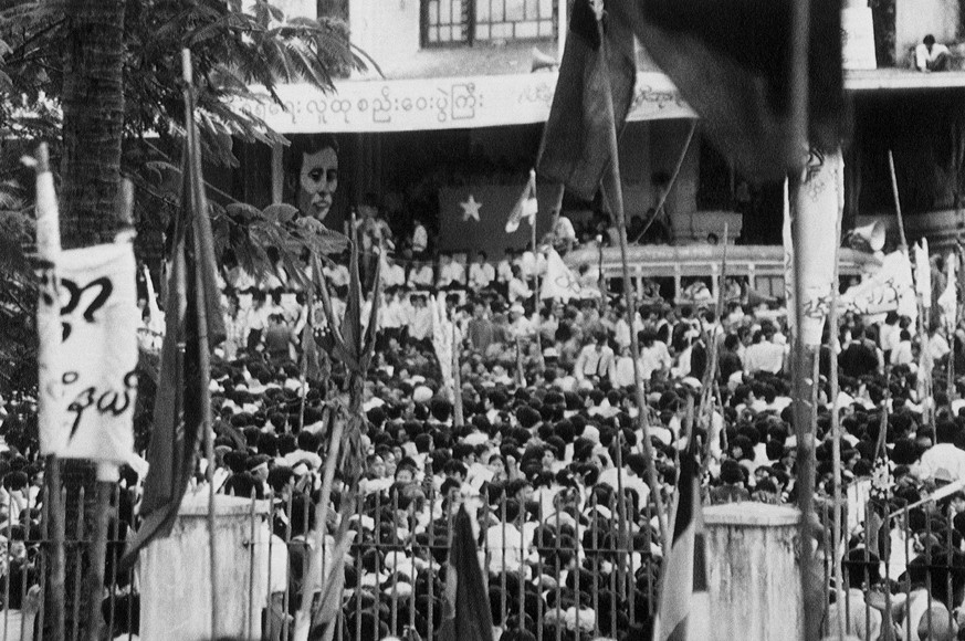 FILE - In this Aug. 27, 1988, file photo, people gather to listen to Aung San Suu Kyi, daughter of slain national hero Aung San, speak in Rangoon, Burma, now known as Yangon. Myanmar&#039;s military h ...