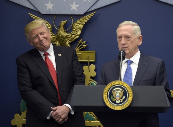 President Donald Trump, left, listens as Defense Secretary James Mattis, right, speaks at the Pentagon in Washington, Friday, Jan. 27, 2017. (AP Photo/Susan Walsh)