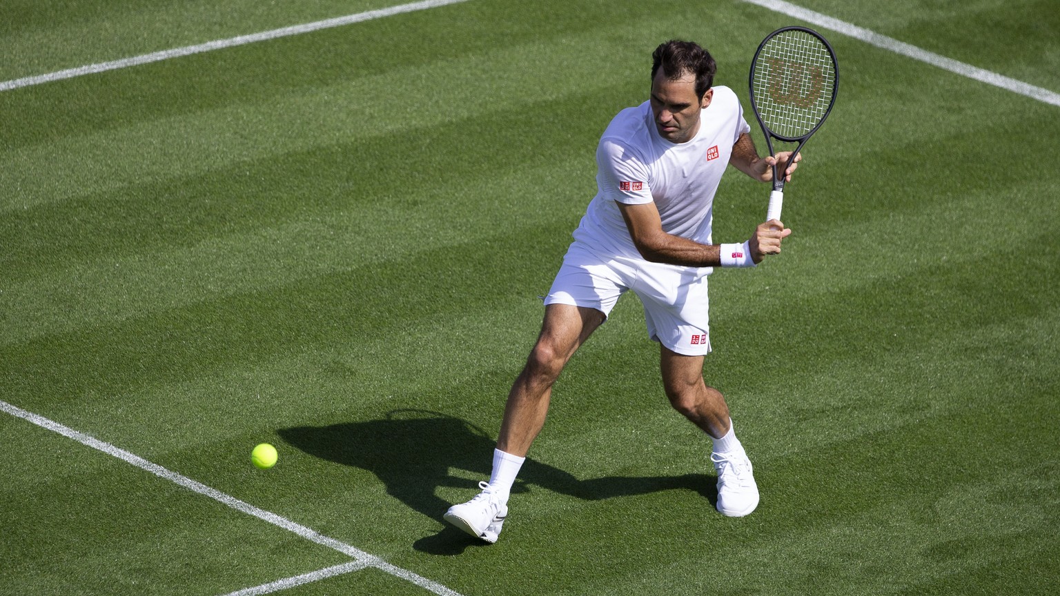 Roger Federer of Switzerland hits a ball during training session at the All England Lawn Tennis Championships in Wimbledon, London, on Wednesday, June 26, 2019. The Wimbledon Tennis Championships 2019 ...