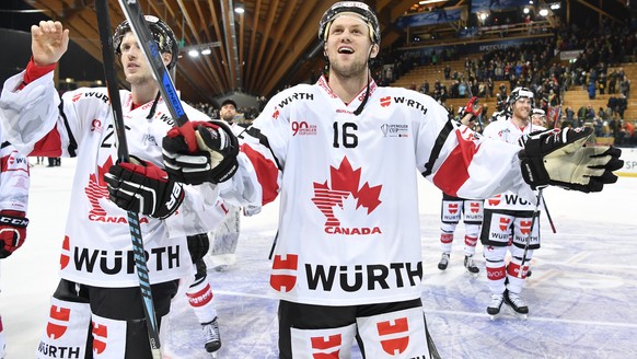 Team Canada&#039;s Nick Spaling, center, and teammates celebrate after qualifying for the semifinals, after the game between Mountfield HK and Team Canada at the 90th Spengler Cup ice hockey tournamen ...