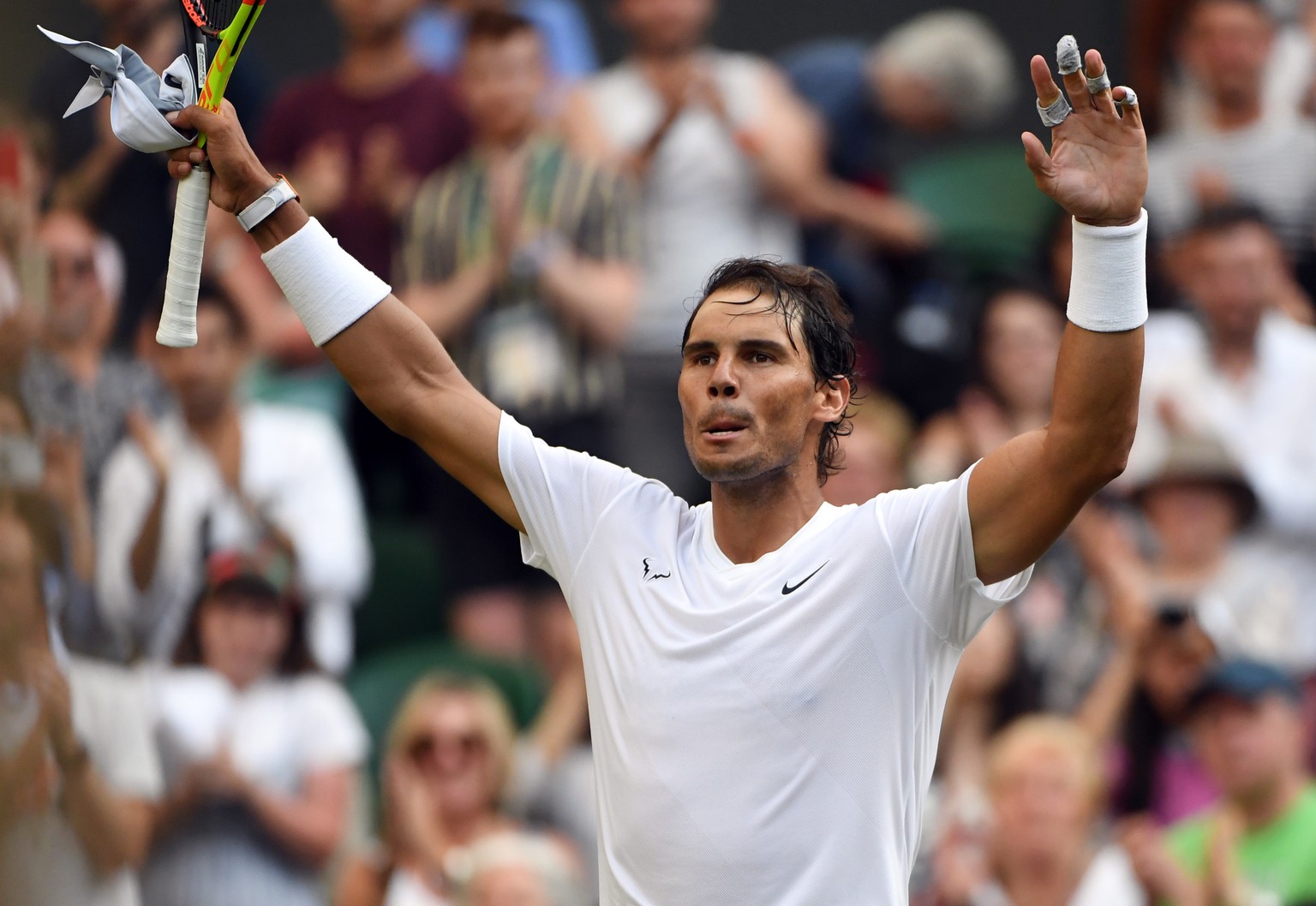 epa07695639 Rafael Nadal of Spain celebrates his win over Nick Kyrgios of Australia in their second round match during the Wimbledon Championships at the All England Lawn Tennis Club, in London, Brita ...