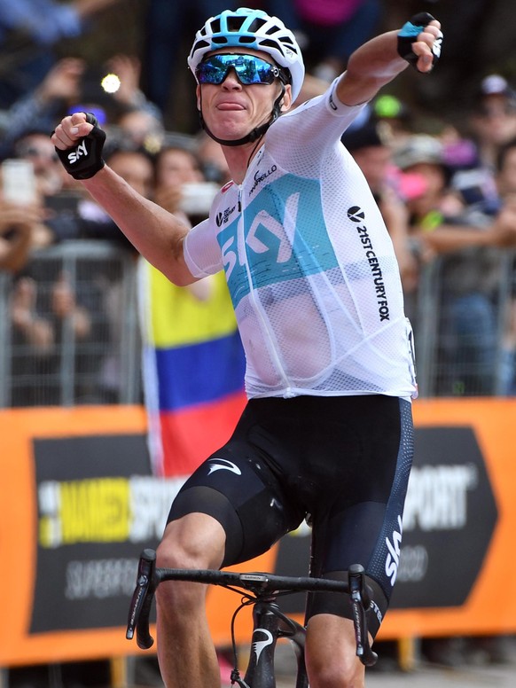 epa06763181 British rider Chris Froome of Team Sky celebrates as he crosses the finish line to win the 19th stage of the Giro d&#039;Italia cycling race, over 185 km from Venaria Reale to Bardonecchia ...