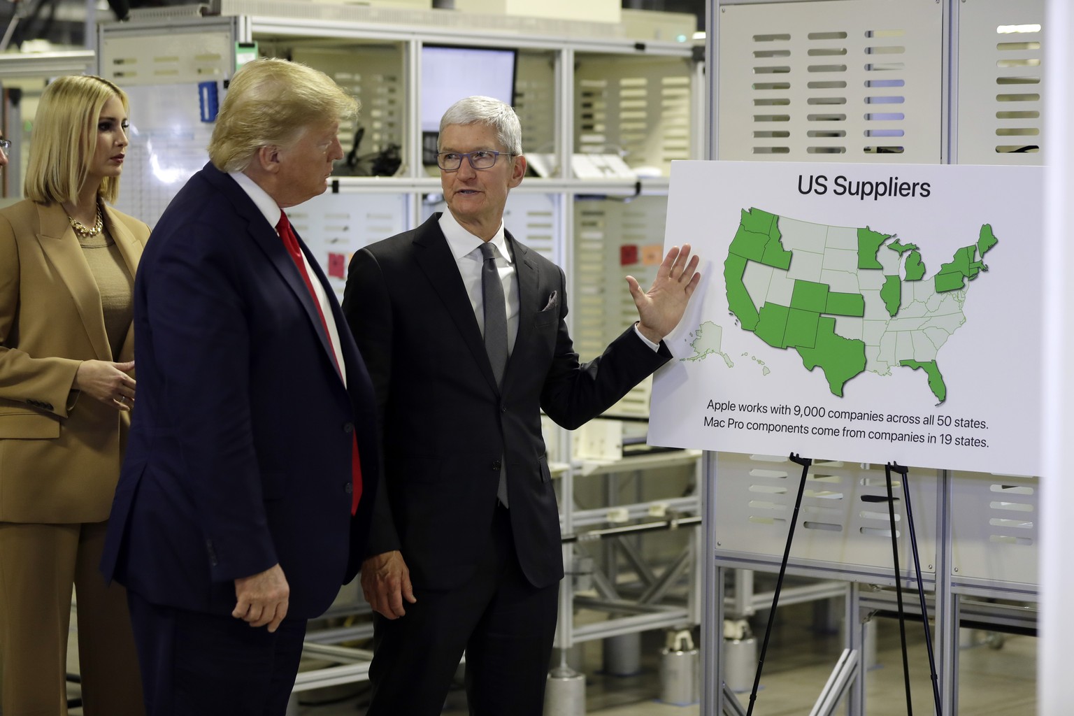 President Donald Trump tours an Apple manufacturing plant, Wednesday, Nov. 20, 2019, in Austin with Apple CEO Tim Cook and Ivanka Trump, the daughter and adviser of President Donald Trump, left. (AP P ...