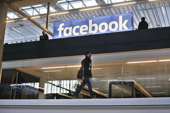 FILE - In this Jan.17, 2017 file photo, the Facebook logo is displayed in a start-up companies gathering at Paris&#039; Station F, in Paris. France&#039;s lower house of parliament has approved a pion ...