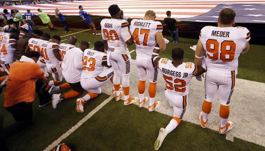 Members of the Cleveland Browns take a knee during the national anthem before an NFL football game against the Indianapolis Colts in Indianapolis, Sunday, Sept. 24, 2017. (AP Photo/Michael Conroy)