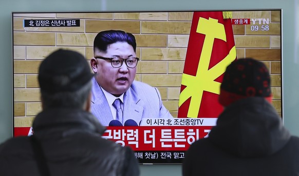 In this Jan. 1, 2018, file photo, South Koreans watch a TV news program showing North Korean leader Kim Jong Un&#039;s New Year&#039;s speech, at the Seoul Railway Station in Seoul, South Korea. The l ...
