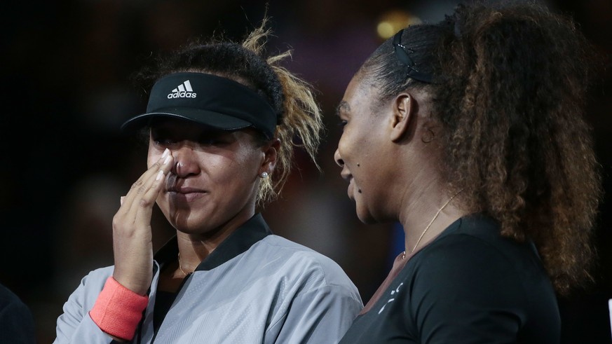 Naomi Osaka, of Japan, wipes a tear as she talks with Serena Williams after Osaka defeated Williams in the women&#039;s final of the U.S. Open tennis tournament, Saturday, Sept. 8, 2018, in New York.  ...