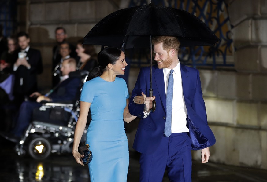 FILE - In this Thursday, March 5, 2020 file photo, Britain&#039;s Prince Harry and Meghan, the Duke and Duchess of Sussex arrive at the annual Endeavour Fund Awards in London. Harper Collins U.K. anno ...