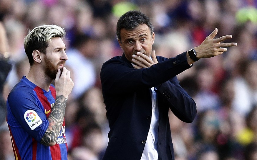 FC Barcelona&#039;s Lionel Messi, left, talks with his coach Luis Enrique during the Spanish La Liga soccer match between FC Barcelona and Deportivo Coruna at the Camp Nou in Barcelona, Spain, Saturda ...