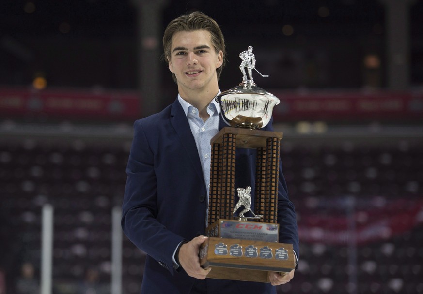 This photo taken May 27, 2017 shows CHL Rookie of the Year Award recipient Nico Hischier, from the Halifax Mooseheads, holding his trophy following a media availability at the Memorial Cup in Windsor, ...