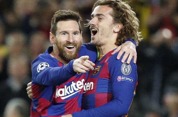 Barcelona&#039;s Lionel Messi, left, celebrates after scoring his side&#039;s second goal with Antoine Griezmann during a Champions League soccer match Group F between Barcelona and Dortmund at the Ca ...