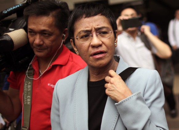 epa07213935 Maria Ressa, CEO and Executive Editor of online news site Rappler and President of Rappler Holdings Corporation, attends a court hearing at a regional trial court in Pasig City, Philippine ...