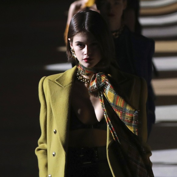 FILE - In this Feb. 25, 2020 file photo, model Kaia Gerber leads other models as they wear creations for the Saint Laurent fashion collection during Women&#039;s fashion week Fall/Winter 2020/21 prese ...