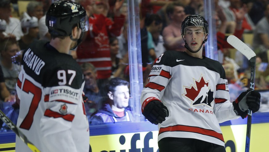Canada&#039;s Ryan Nugent-Hopkins, right, celebrates with Connor McDavid, left, after scoring his sides second goal during the Ice Hockey World Championships group B match between Canada and Germany a ...