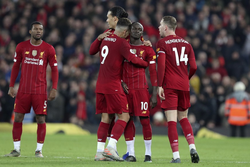Liverpool&#039;s Sadio Mane, 2nd right, celebrates after scoring the opening goal during the English Premier League soccer match between Liverpool and Wolverhampton Wanderers at Anfield Stadium, Liver ...