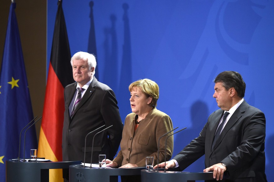Angela Merkel (CDU) mit ihren Koalitionspartnern Horst Seehofer (SPD) und Sigmar Gabriel CSU).