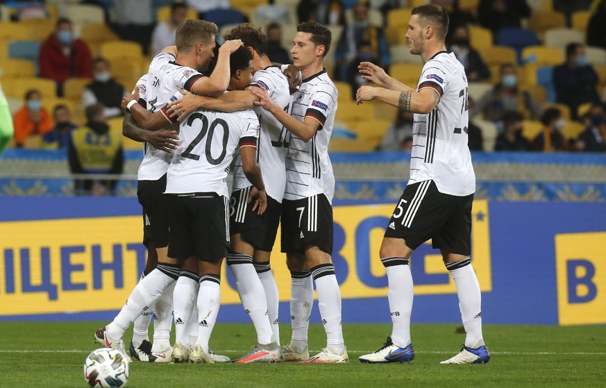 Germany players celebrate after Germany&#039;s Matthias Ginter scored his side&#039;s opening goal during the UEFA Nations League soccer match between Ukraine and Germany at the Olimpiyskiy Stadium in ...