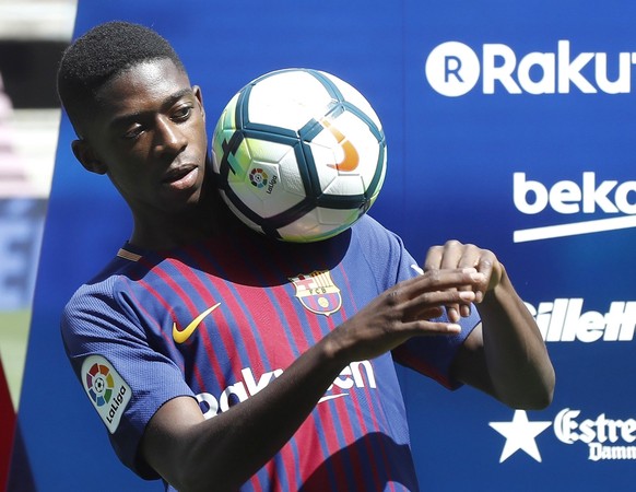 epa06168414 Barcelona&#039;s FC new player, French Ousmane Dembele, poses during his presentation at Camp Nou stadium in Barcelona, Spain, 28 August 2017. Dembele, from Borussia Dortmund, signed a 105 ...