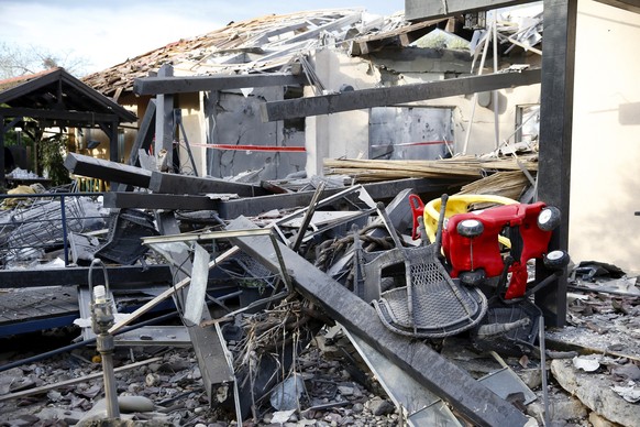 A house lies in ruins after being hit by a rocket in Mishmeret, central Israel, Monday, March 25, 2019. An early morning rocket from the Gaza Strip struck a house in central Israel on Monday, wounding ...