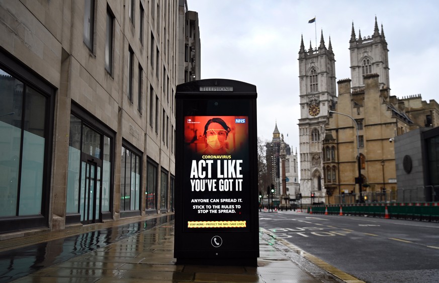epa08951550 A coronavirus public health notice at a bus stop in London, Britain, 20 January 2021. Britain&#039;s national health service (NHS) is coming under severe pressure as Covid-19 hospital admi ...