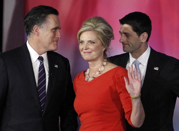 FILE - This Nov. 7, 2012 file photo shows Republican presidential candidate and former Massachusetts Gov. Mitt Romney, left, talking to his running mate, Rep. Paul Ryan, R-Wis., as Ann Romney waves af ...
