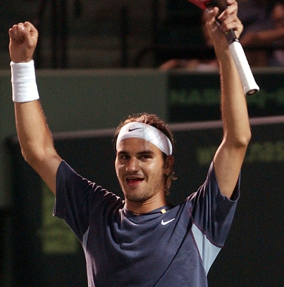 Roger Federer of Switzerland celebrates after defeating Lleyton Hewitt of Australia 6-3, 6-4, in the semifinals of the Nasdaq-100 Open, Friday, March 29, 2002, in Key Biscayne, Fla. (AP Photo/Alan Dia ...