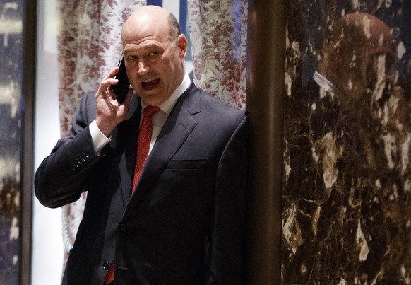 In this Nov. 29, 2016 photo, Goldman Sachs COO Gary Cohn talks on his phone as he waits for the start of a meeting with President-elect Donald Trump at Trump Tower in New York. Trump is expected to pi ...