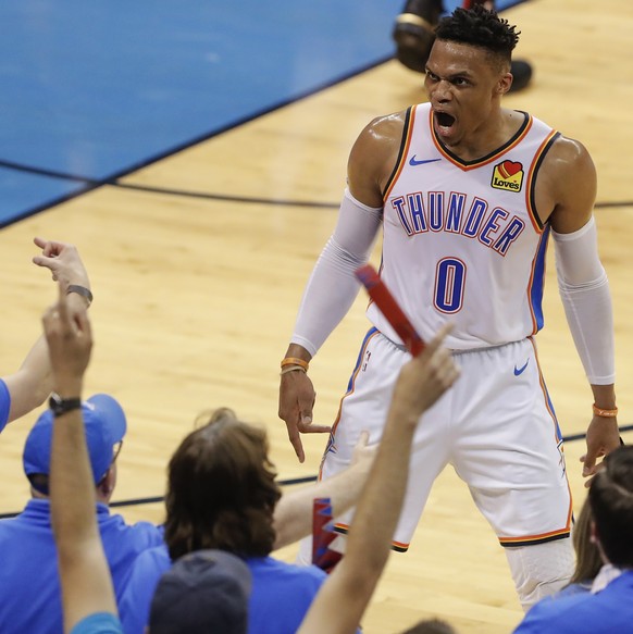 Oklahoma City Thunder guard Russell Westbrook (0) celebrates after scoring against the Portland Trail Blazers in the first half of Game 4 of an NBA basketball first-round playoff series Sunday, April  ...