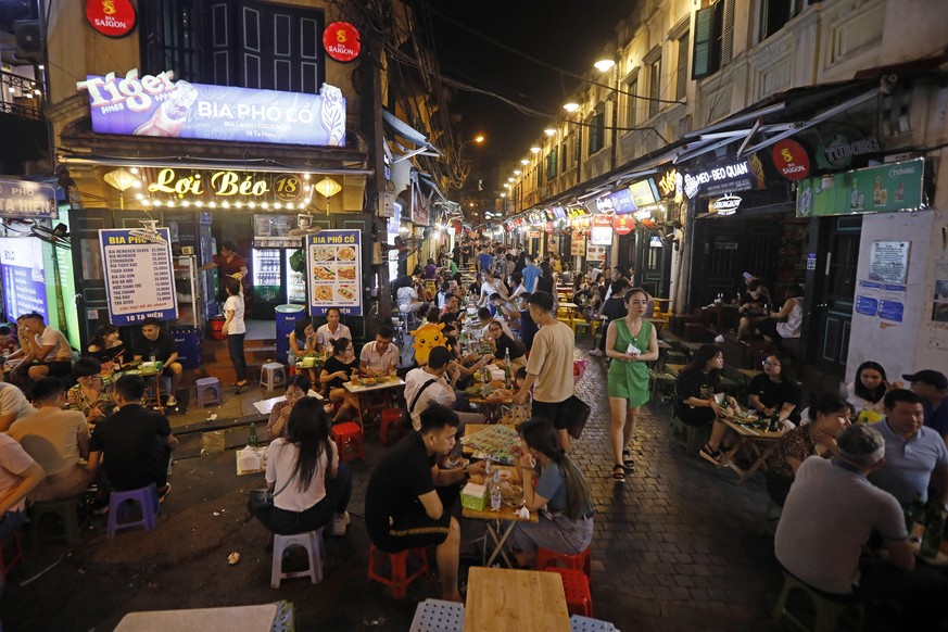 epa08437824 People drink beer at the Bia Hoi Corner in the Old Quarter of Hanoi, Vietnam, 22 May 2020. Vietnam reopened many tourist attractions after a long shutdown due to the COVID-19 disease pande ...