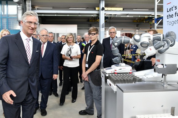King Philippe of Belgium, left, and Swiss Federal Councillor Johann Schneider-Ammann, right, at his visit of ABB Turbo Systems AG in Baden, Switzerland, Friday, June 23, 2017. (Walter Bieri/Keystone v ...